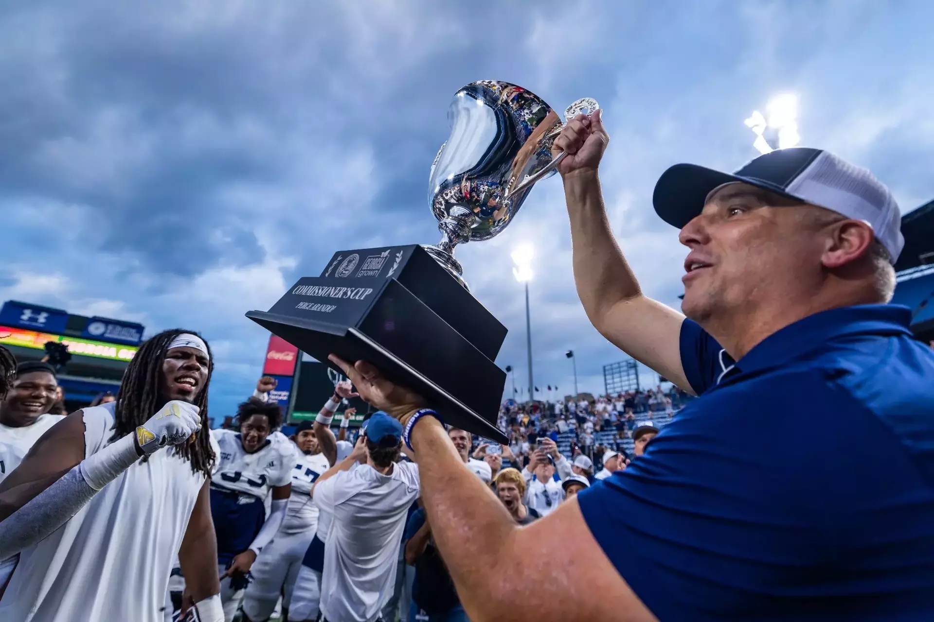 Georgia Southern Head Football Coach Clay Helton Lifts Commissioner’s Cup Trophy After Winning Inaugural Georgia Grown Bowl at Centre Parc Stadium in Atlanta, Ga. Photo by AJ Henderson / Georgia Southern University Georgia Southern Head Football Coach Clay Helton Lifts Commissioner’s Cup Trophy After Winning Inaugural Georgia Grown Bowl at Centre Parc Stadium in Atlanta, Ga. Photo by AJ Henderson / Georgia Southern University
