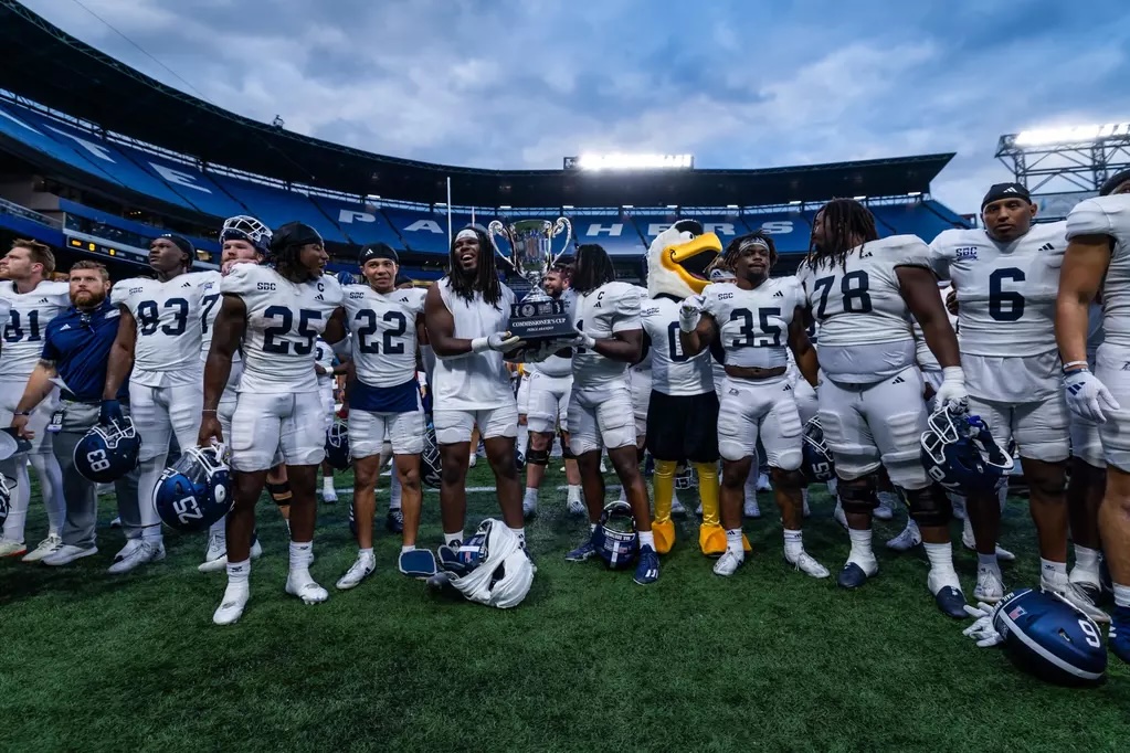 Georgia Southern Players Pose with the Commissioner’s Cup Trophy. Photo by AJ Henderson / Georgia Southern University Georgia Southern Players Pose with the Commissioner’s Cup Trophy. Photo by AJ Henderson / Georgia Southern University