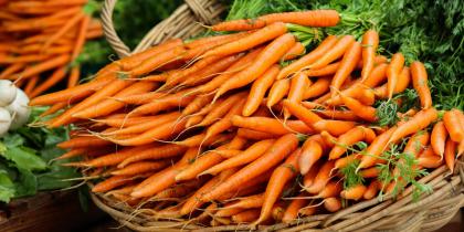 Bunches of Carrots in Baskets