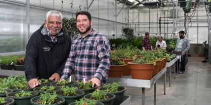 Two Men In Greenhouse